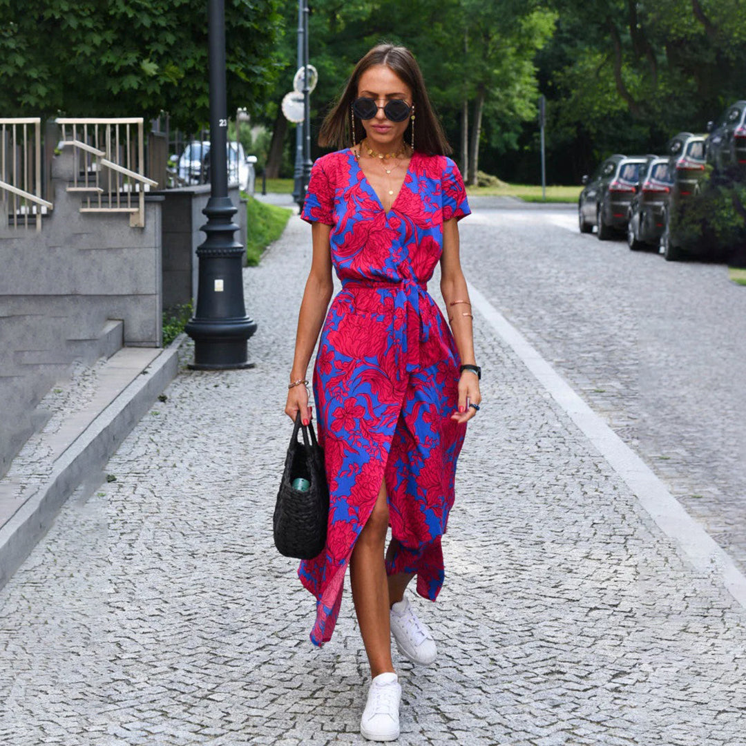 Women's floral wrap midi dress with short sleeves, perfect for summer events.