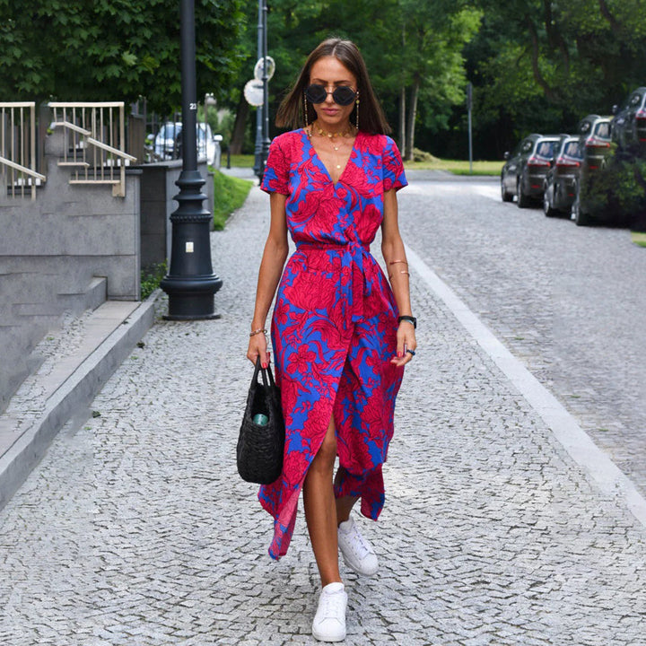 Women's floral wrap midi dress with short sleeves, perfect for summer events.