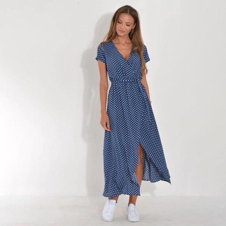 Casual women's short sleeve floral wrap midi dress, vibrant summer fashion.