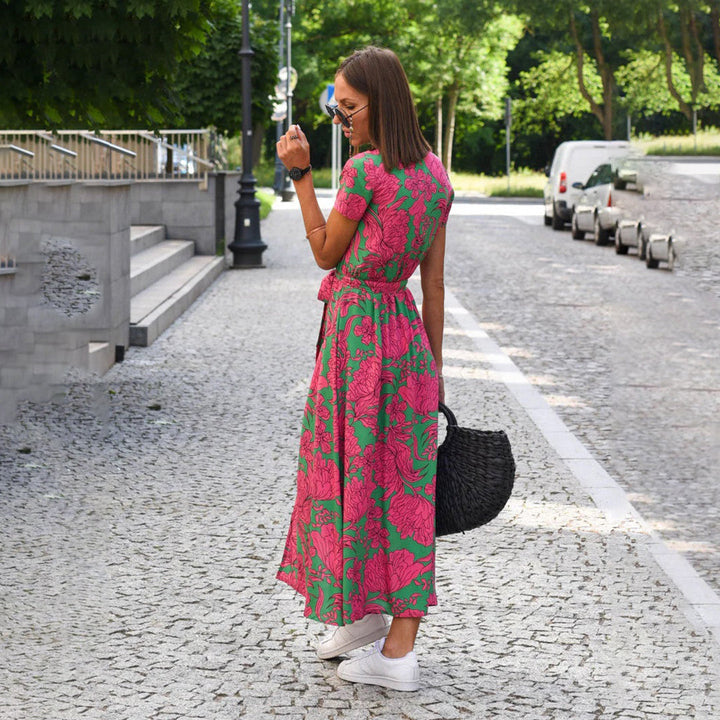 Summer women's floral wrap midi dress, short sleeves, vibrant pattern, comfortable fit.