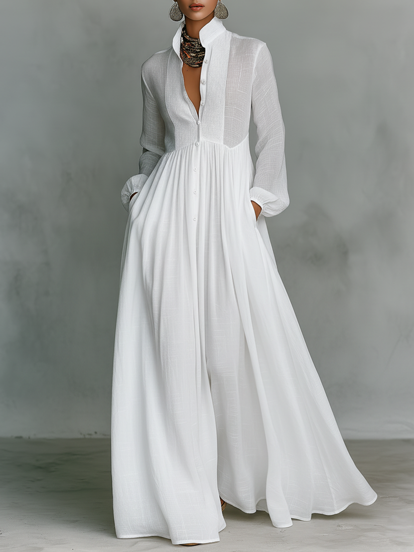 Women's flowing A-line maxi dress, long sleeve, V-neck, with convenient pockets for an effortless look.