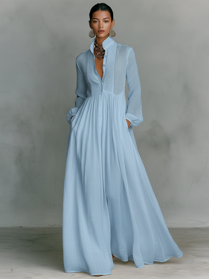 Stylish women's long sleeve V-neck maxi dress, A-line cut, flowing fabric, and practical pockets.