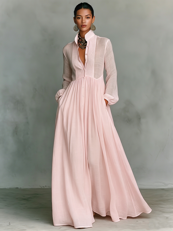 Women's relaxed flowing maxi dress, A-line silhouette, long sleeve, V-neck, and handy pockets.