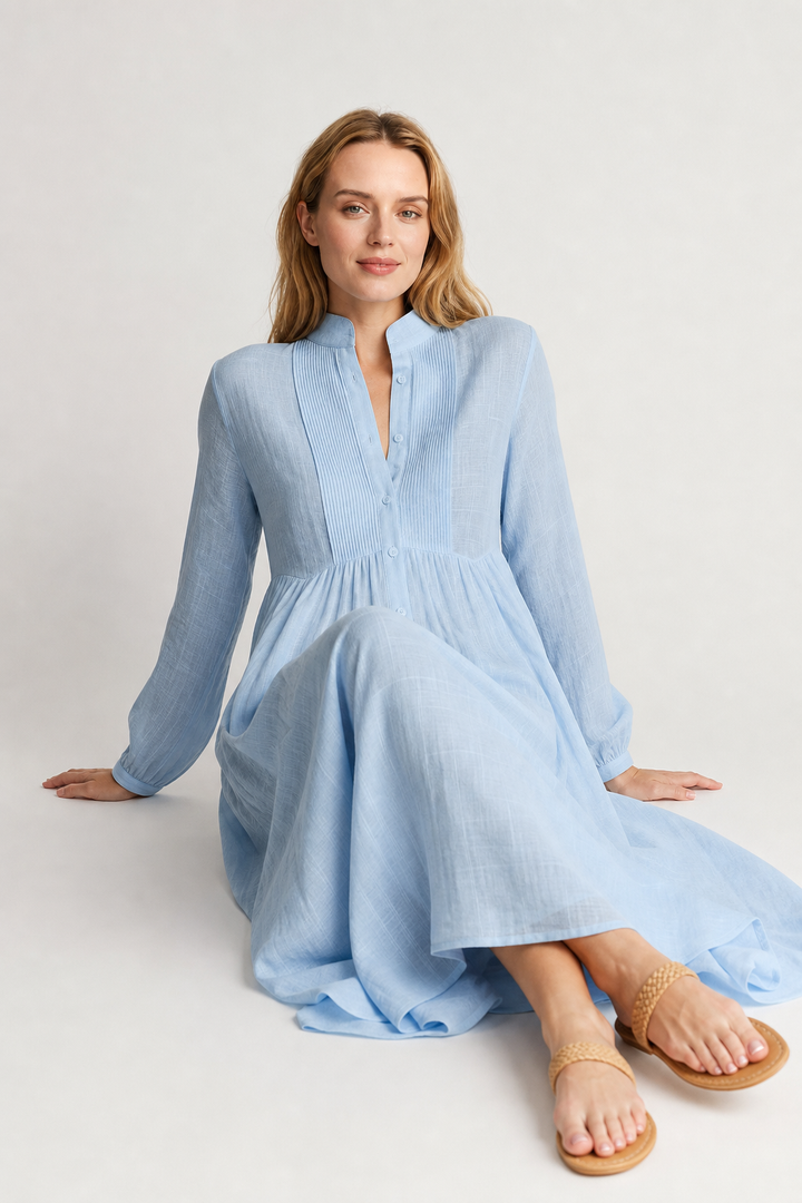 Stylish women's everyday maxi dress, flowing A-line cut with long sleeves, V-neck, and functional pockets.