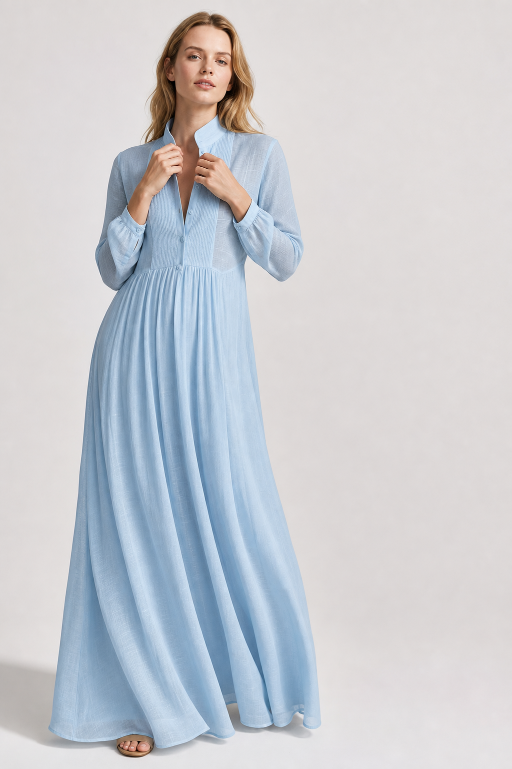 Flowing women's casual maxi dress with pockets, A-line silhouette, long sleeves, and flattering V-neck.
