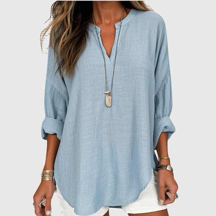 Women's flowing elegant beach shirt, perfect for summer comfort and resort wear, a stylish long-sleeve blouse.