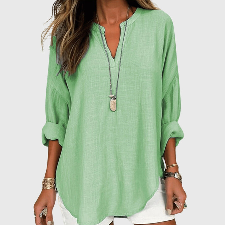 Stylish women's summer beach shirt, a casual yet elegant flowing top, comfortable for resort and vacation wear.