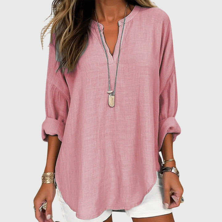 Comfortable women's flowing beach blouse, a long-sleeve summer shirt perfect for elegant vacation style.