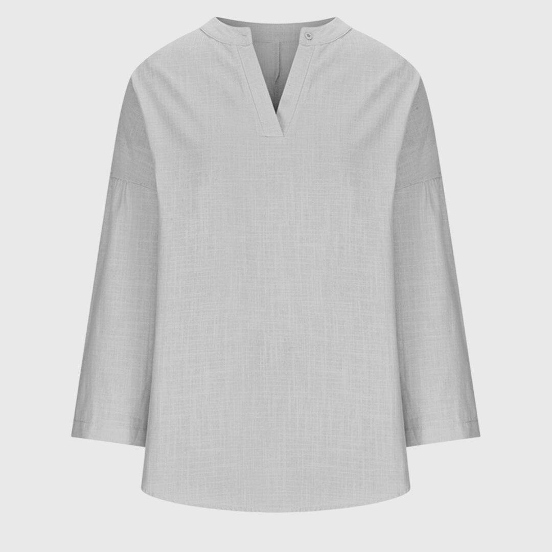 Chic women's summer beach shirt, a comfortable flowing top, perfect for elegant vacation and resort fashion.