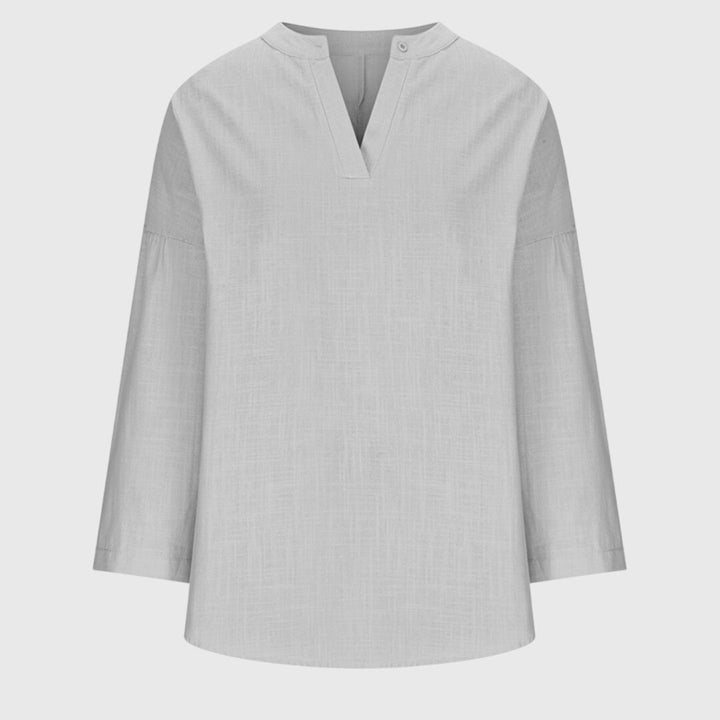 Chic women's summer beach shirt, a comfortable flowing top, perfect for elegant vacation and resort fashion.