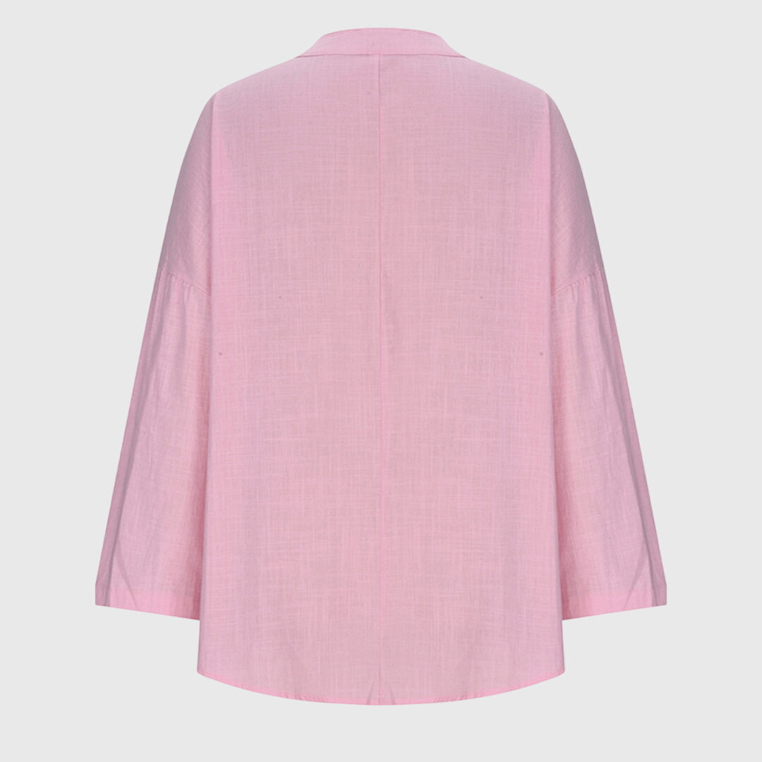 Lightweight women's flowing beach blouse, an elegant long-sleeve shirt for summer comfort and stylish wear.