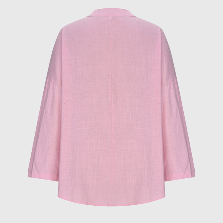 Lightweight women's flowing beach blouse, an elegant long-sleeve shirt for summer comfort and stylish wear.