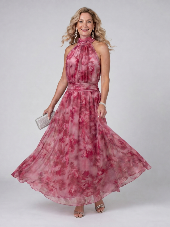 Elegant sleeveless halter neck midi dress for women, ideal party wear. Features a beautiful flowing silhouette.