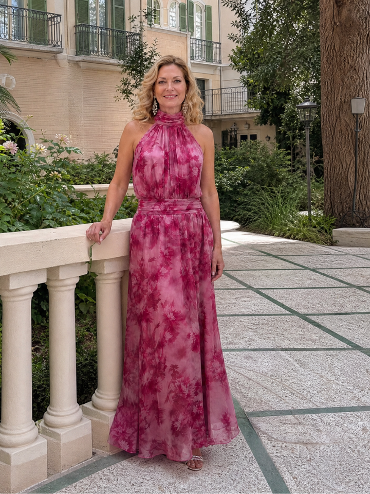 Comfortable women's flowing midi dress featuring a flattering halter neckline, ideal for warm weather events.