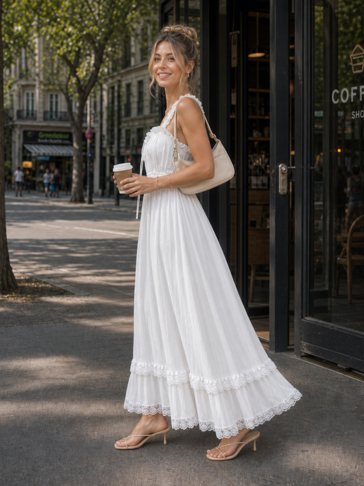 Stylish women's sleeveless midi dress, featuring graceful ruffle straps & a flowing silhouette, perfect for summer fashion.
