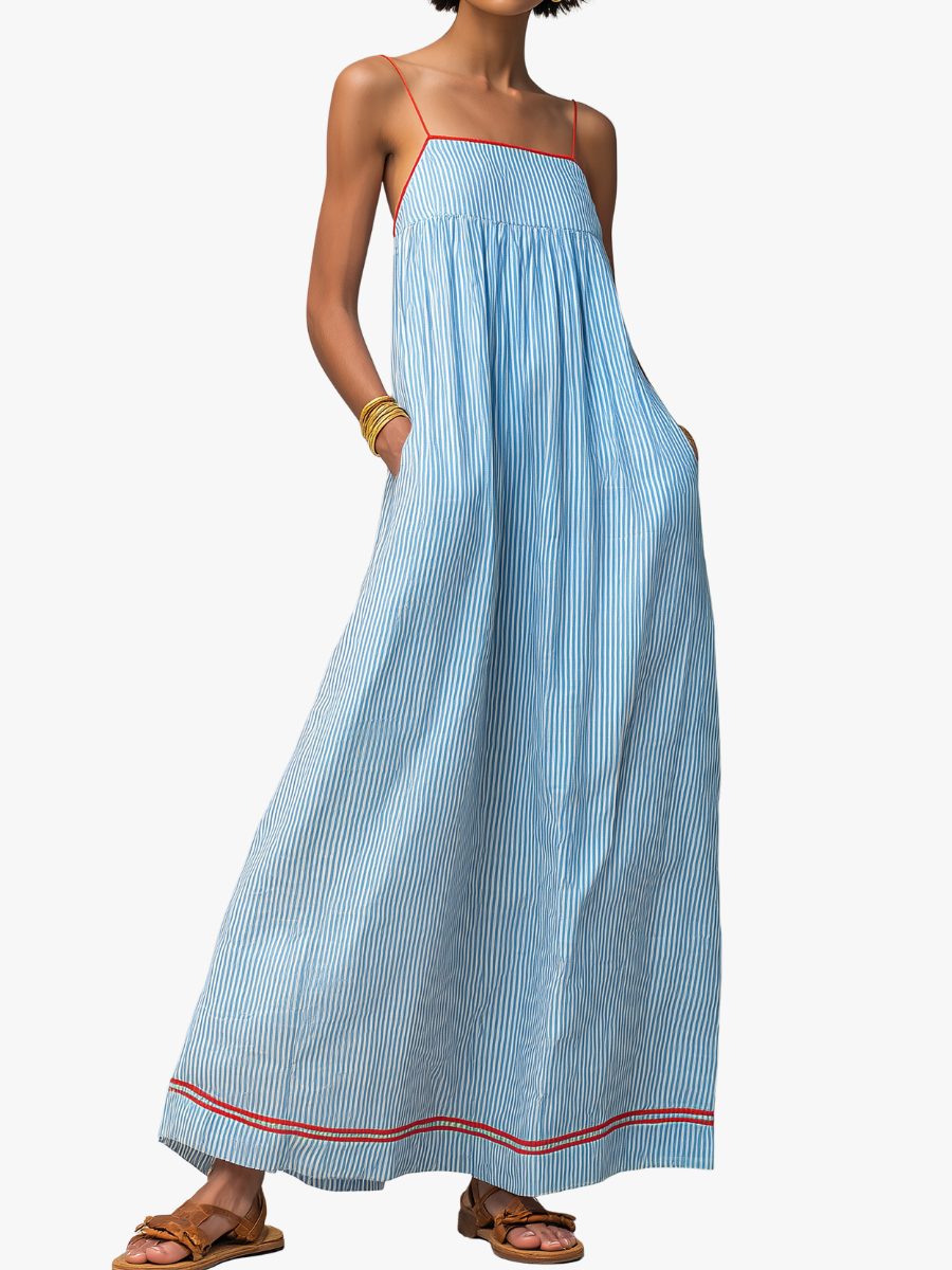 Women's flowing striped maxi dress with practical pockets, perfect for summer casual wear.