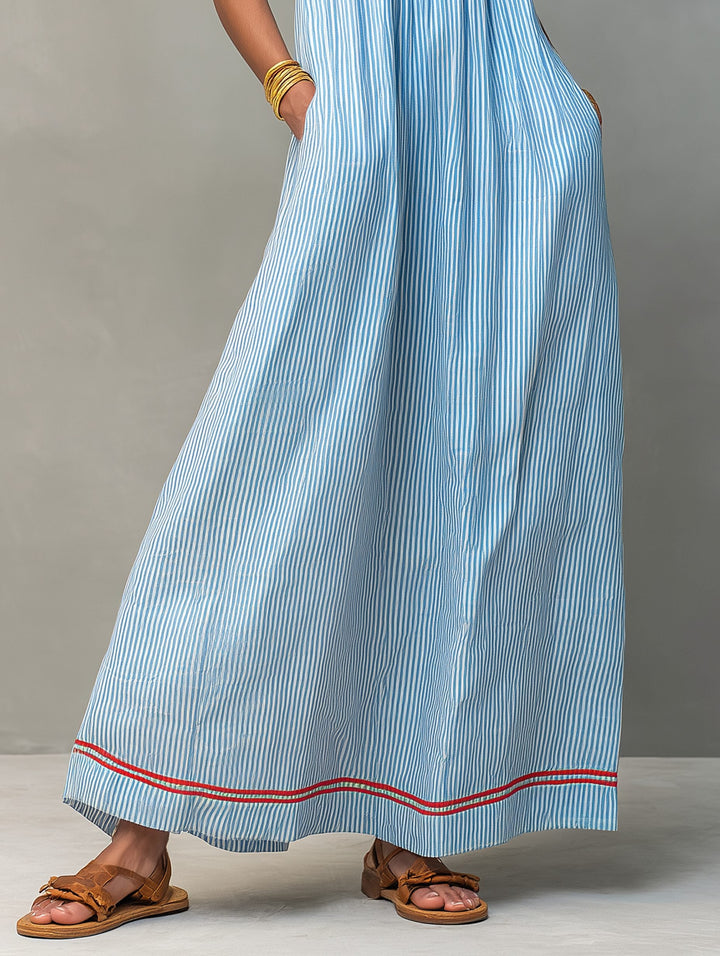 Flowy sleeveless women's striped maxi dress, perfect for casual summer wear or vacation beach days.