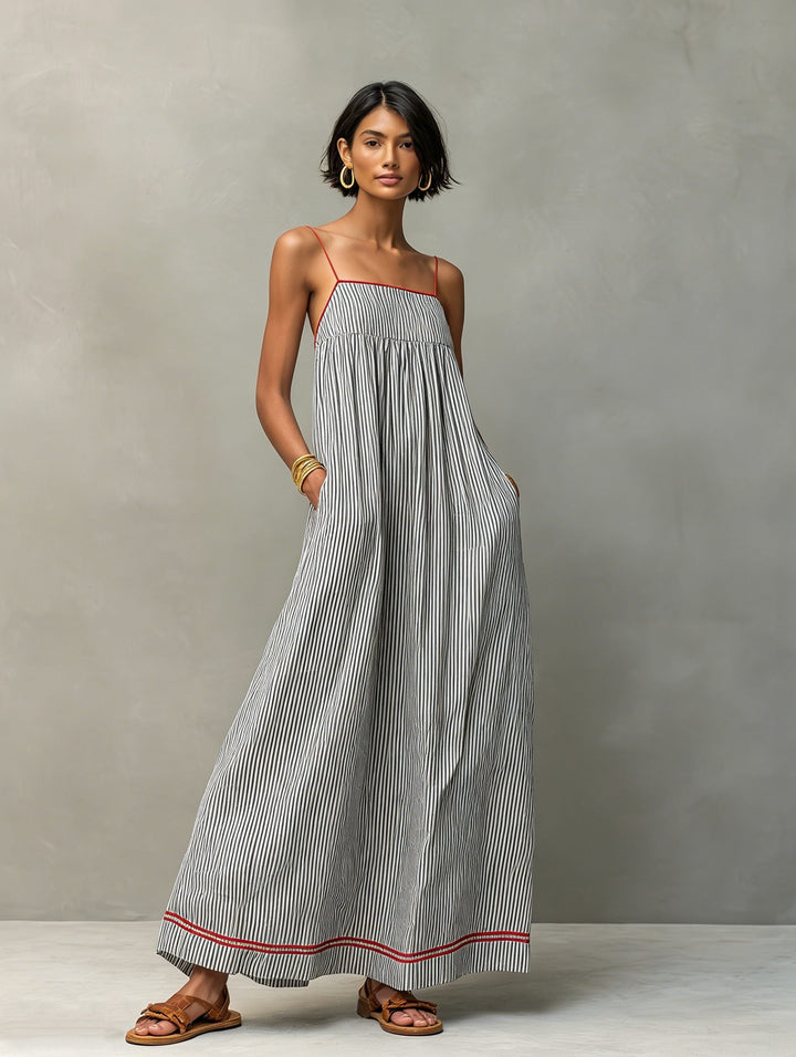 Casual women's striped maxi dress featuring a flowy silhouette & convenient pockets for summer.
