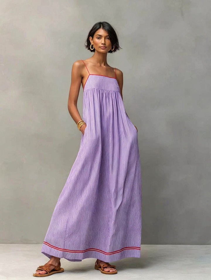 Chic striped maxi dress for women, sleeveless and flowy, perfect for elegant summer events.
