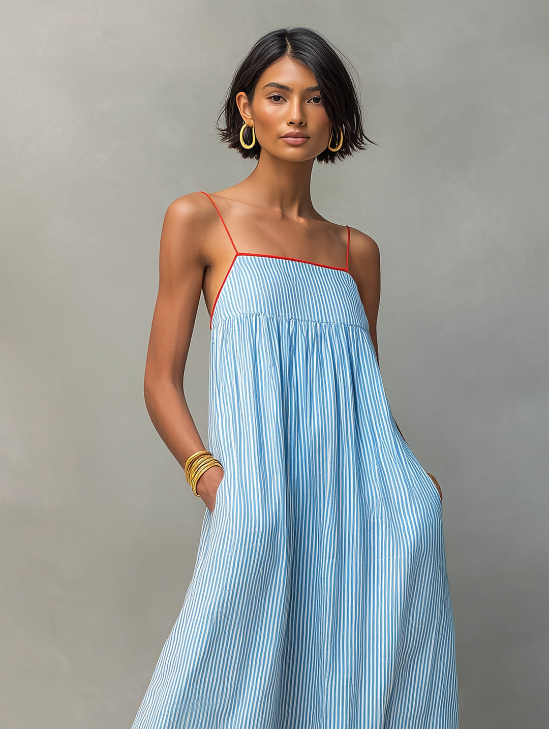 Women's summer striped maxi dress, casual yet elegant, featuring a flowy style and pockets.