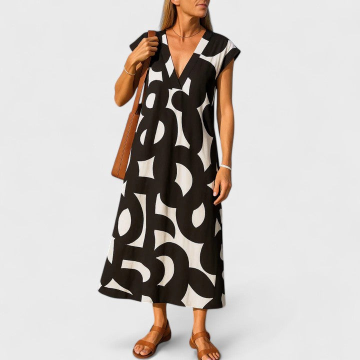 Women's flowing V-neck summer maxi dress, perfect for casual elegant warm weather.