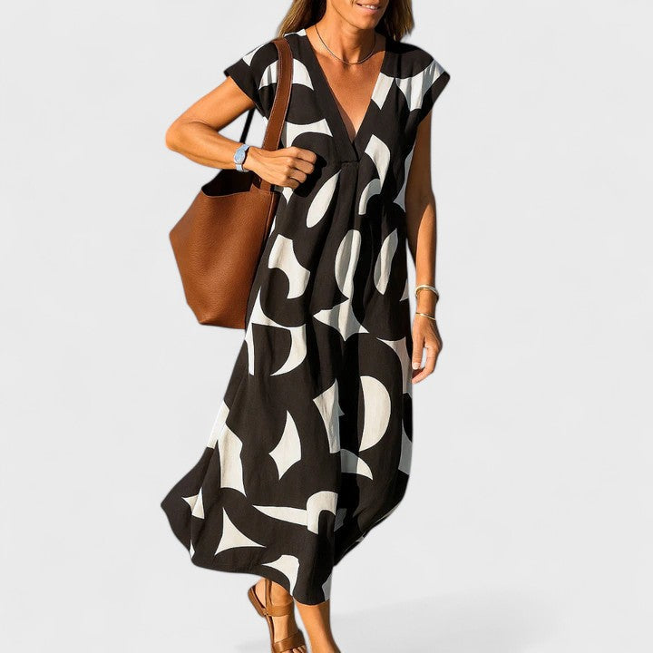 Comfortable & versatile women's flowing V-neck summer dress for a relaxed yet elegant look.