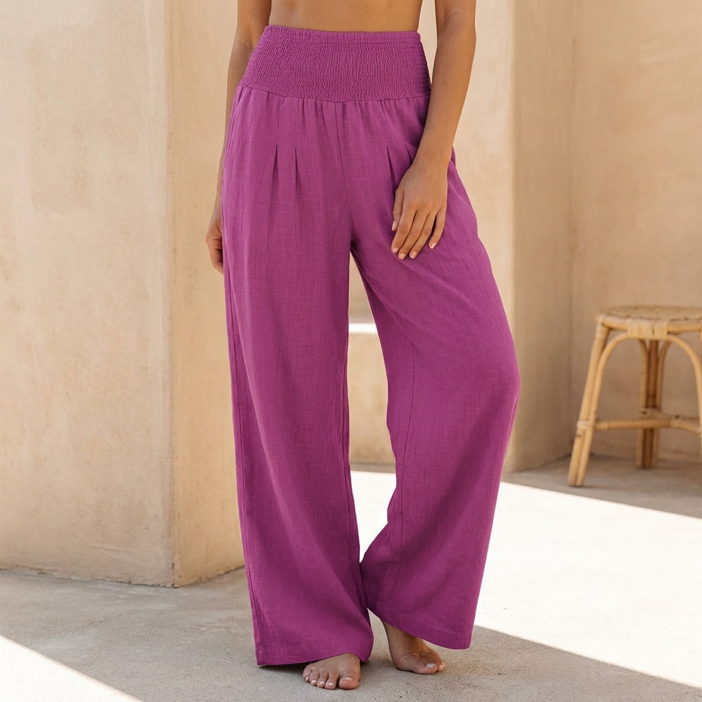 Women's flowing wide-leg pants with comfortable smocked waist, perfect for summer.