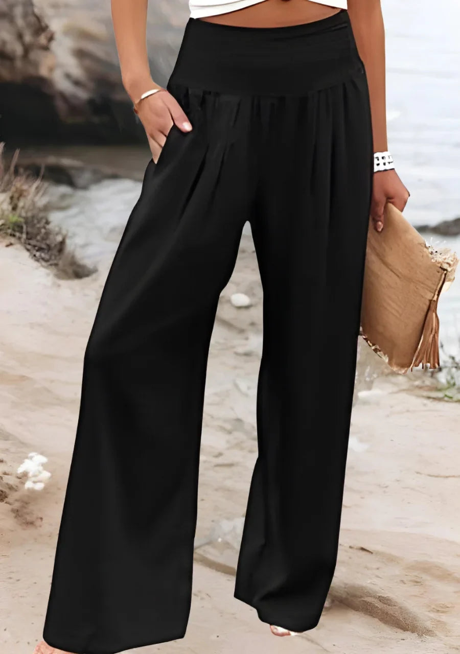 Elegant women's wide leg pants, smocked high-waist, ideal for vacation, beach, or comfortable summer wear.