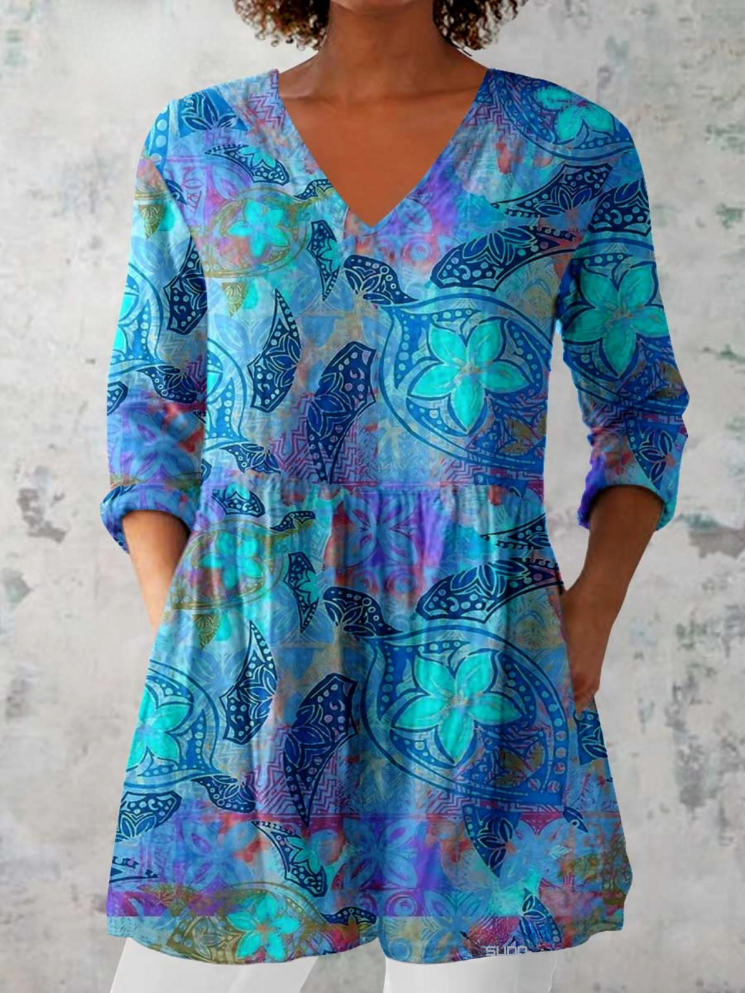 Women's flowy blue V-neck long blouse, perfect for casual or elegant styles, offering comfortable oversized fit.