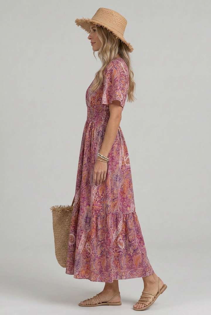 Elegant A-line paisley print maxi dress for women, featuring a smocked waist & flutter sleeves.