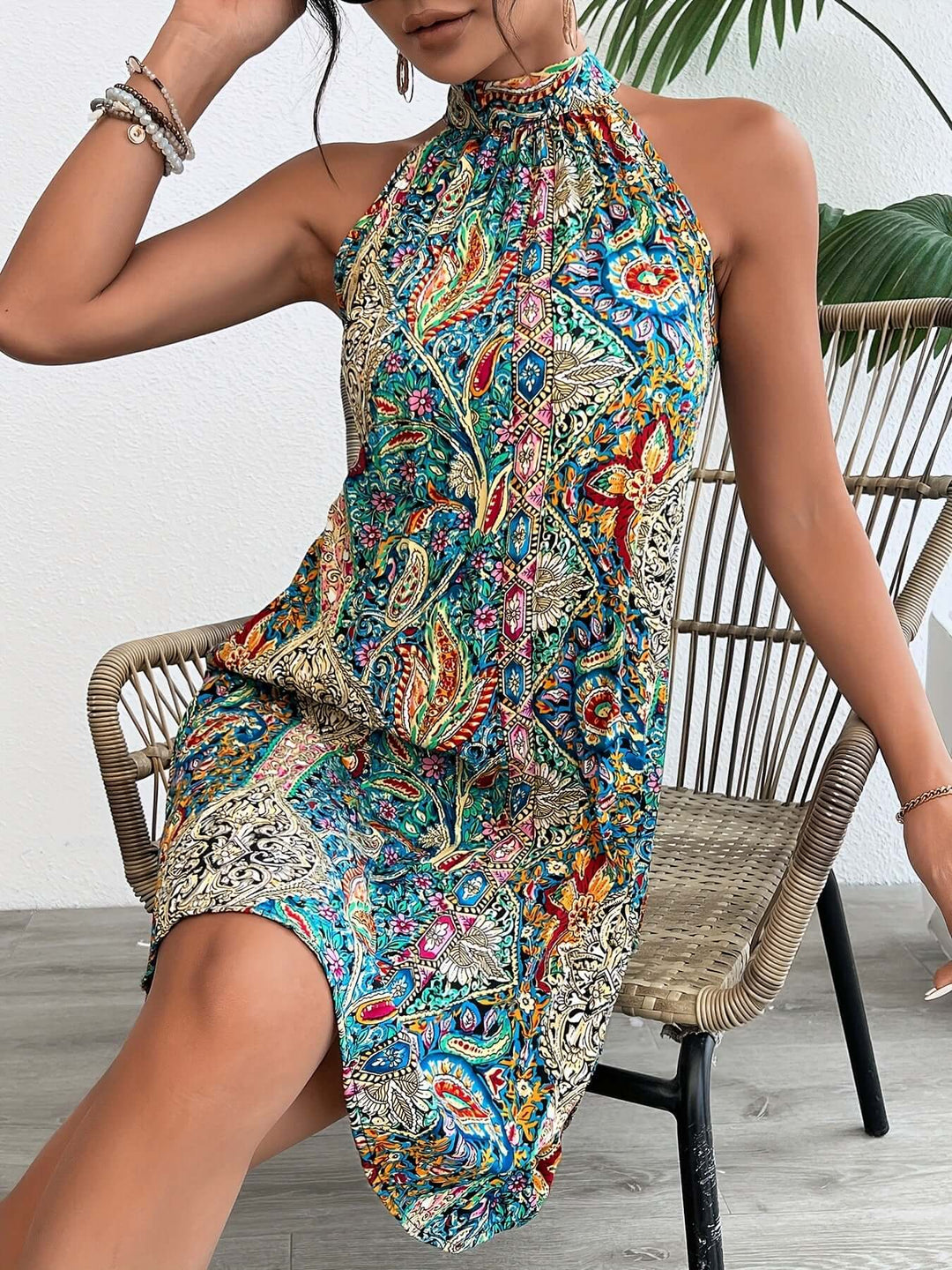 Comfortable women's halter neck boho maxi dress with a colorful paisley print, ideal for resort wear & summer travel.