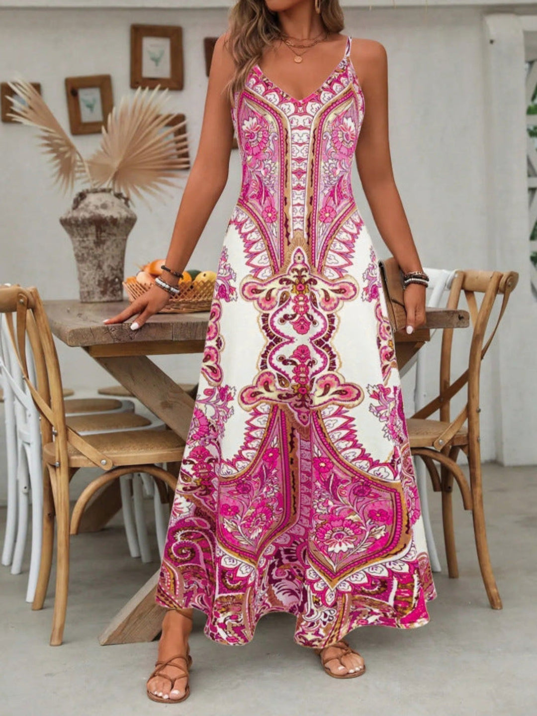 Bohemian style long maxi dress for women, featuring a flattering V-neck and vibrant paisley pattern. Ideal vacation outfit.