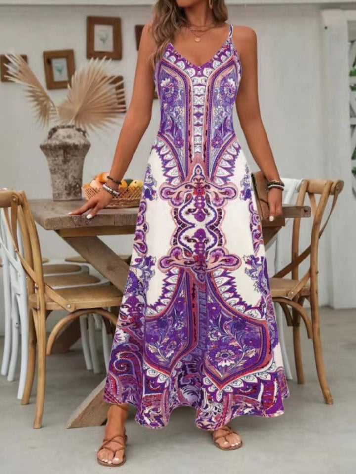 Comfortable women's flowy maxi dress, showcasing a beautiful paisley print and V-neck. Great for summer & beach.