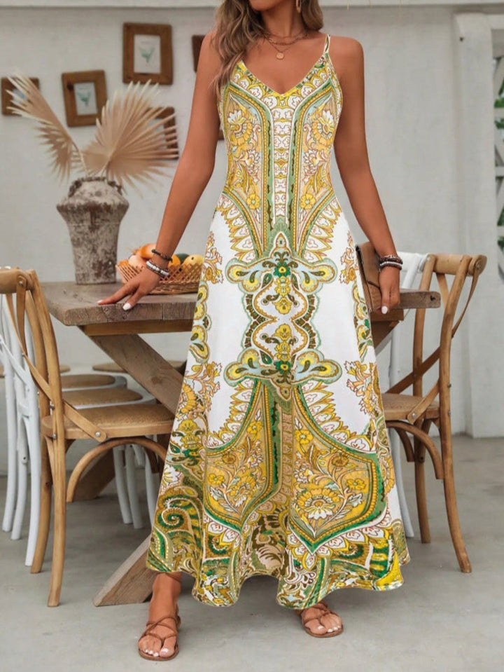 V-neck boho maxi dress for women with unique paisley print. Long, flowy silhouette for a casual, elegant summer look.