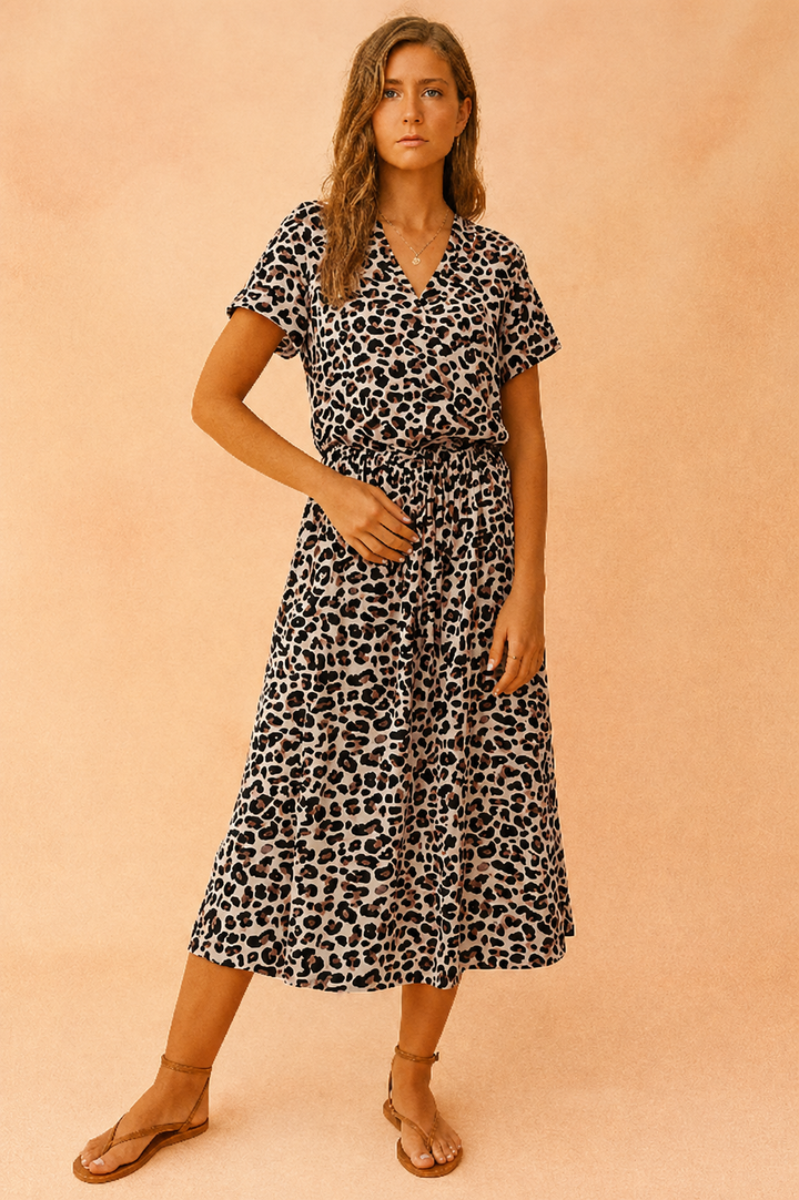 Fashionable women's boho midi dress with all-over polka dots and a practical tie waist, great for summer.