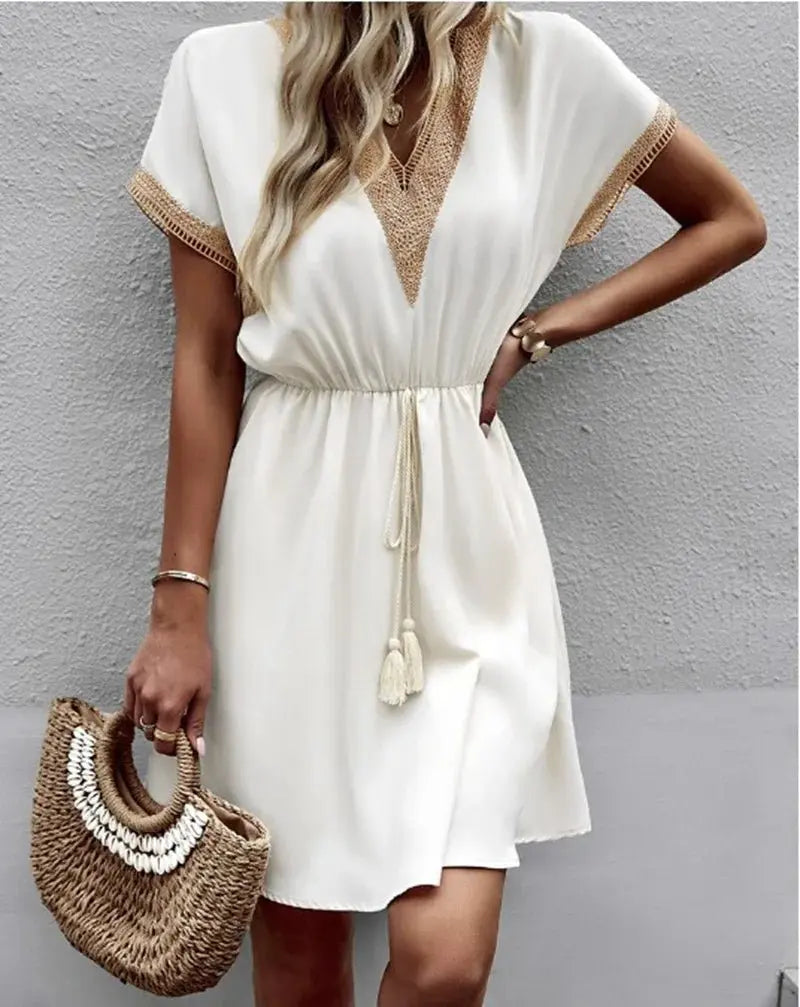 Women's flowy boho V-neck midi dress with tie waist & short sleeves, perfect for summer casual wear.