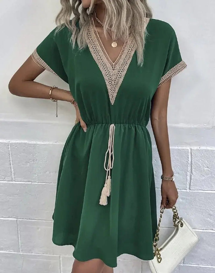 Stylish women's short-sleeve boho midi dress with V-neckline & tie waist, great for summer parties.