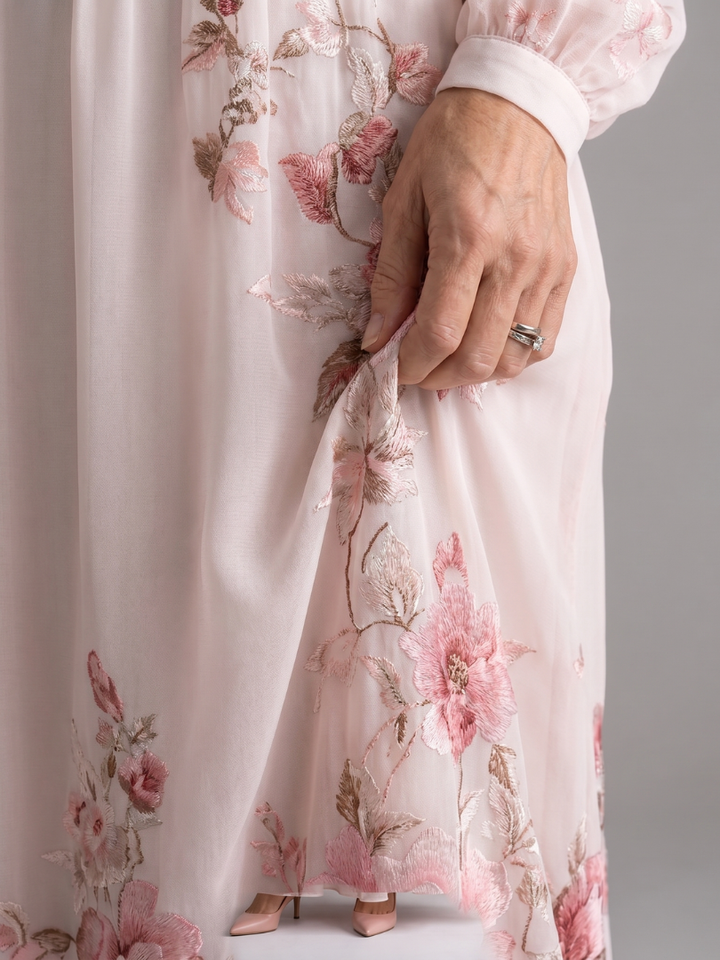 Comfortable flowy women's midi dress in a vibrant floral print with long sleeves, great for everyday elegance.