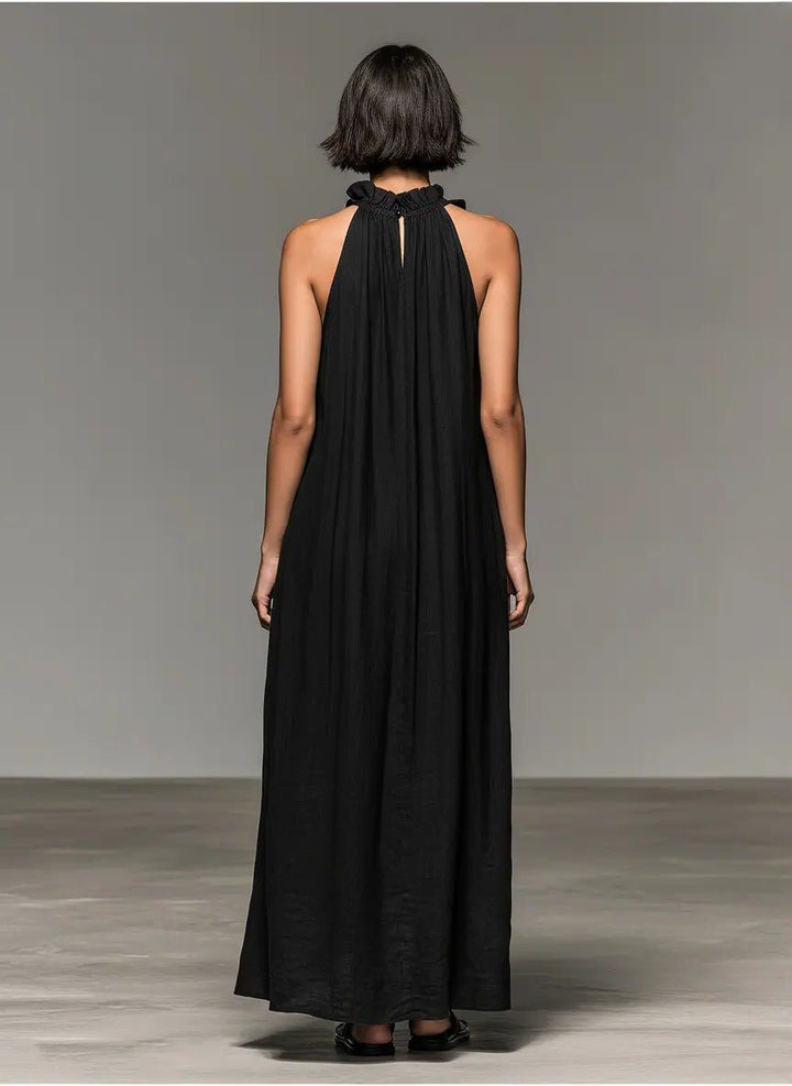 Elegant women's halterneck ruffle maxi dress, ideal for casual summer beachwear or daytime comfort.