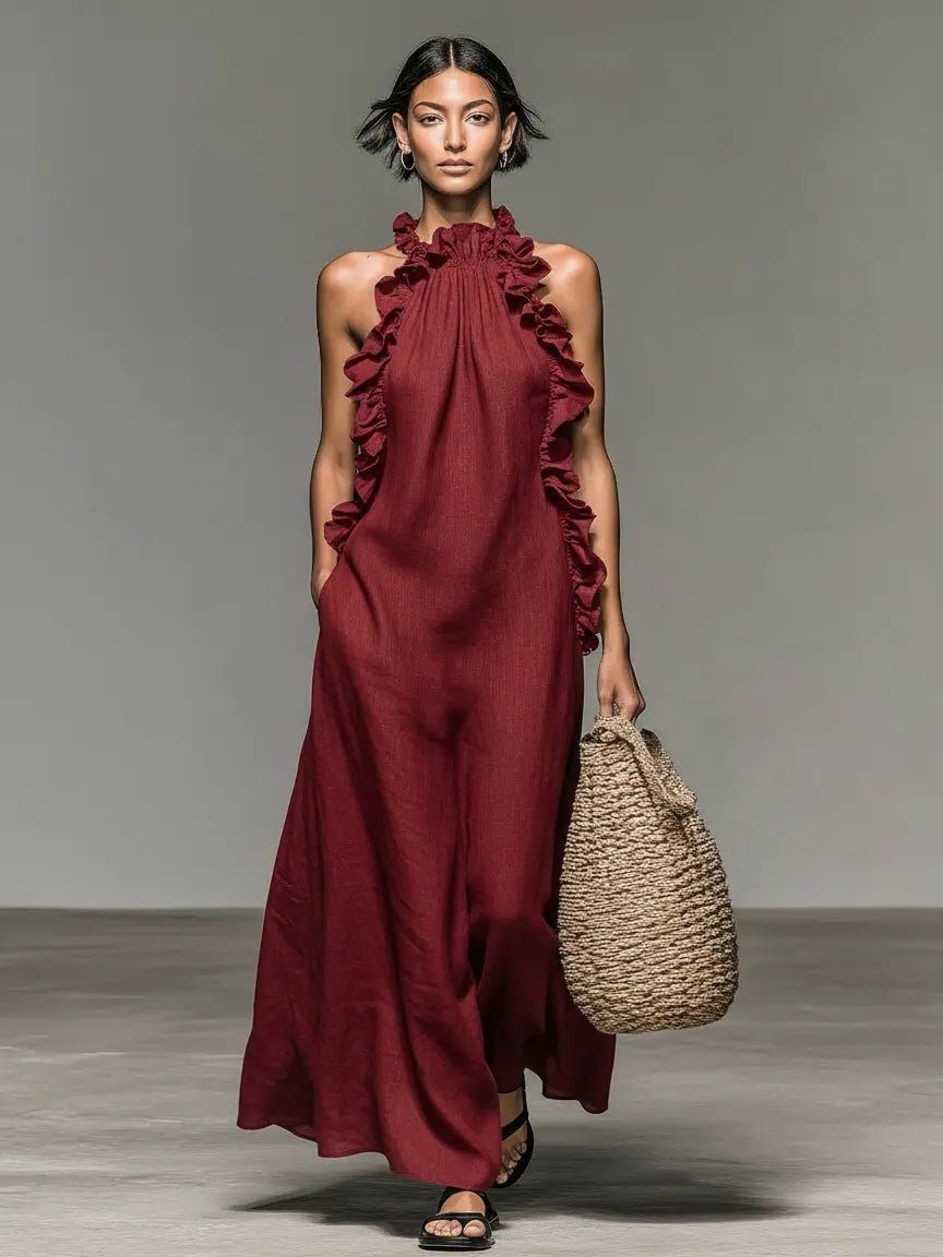 Flowy sleeveless maxi dress for women, featuring a halterneck and elegant ruffles, comfort fit.