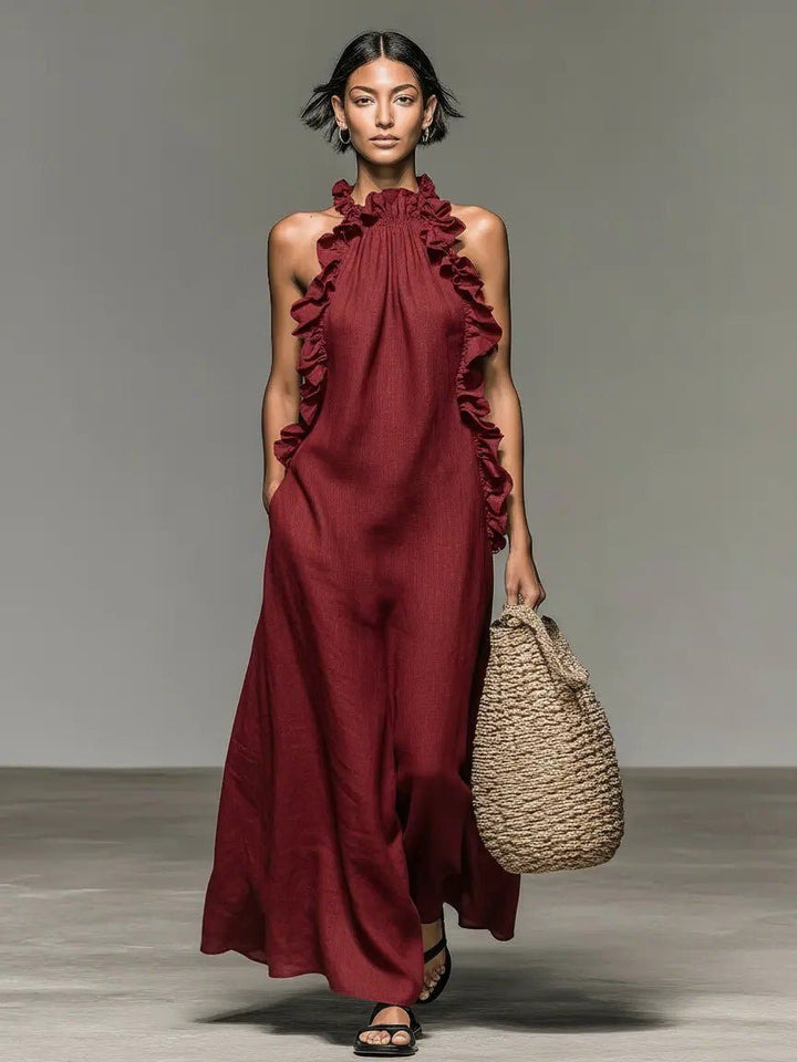 Flowy sleeveless maxi dress for women, featuring a halterneck and elegant ruffles, comfort fit.