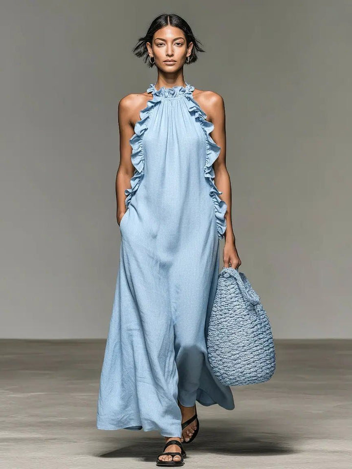 Stylish women's halterneck maxi dress with delicate ruffles, a versatile and flowy summer elegant outfit.