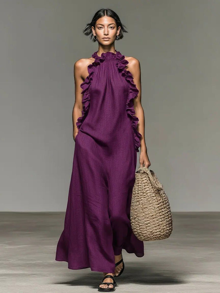 Vacation-ready women's flowy halterneck maxi dress with elegant ruffles, great for beach and resort.