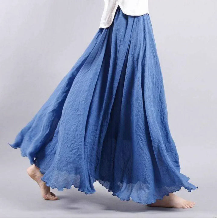 Women's flowy high-waisted boho maxi skirt, ideal for summer fashion & beachwear. Elegant, versatile bohemian style.