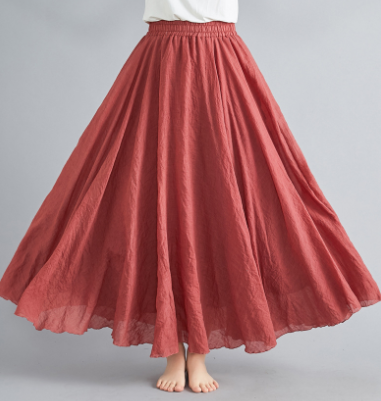 Full-length view of a women's long flowy high-waisted boho maxi skirt, perfect for summer bohemian fashion.