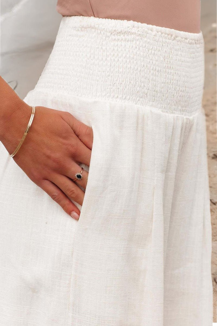 Full view of women's flowy linen wide leg trousers, showcasing elegant drape and comfortable fit.