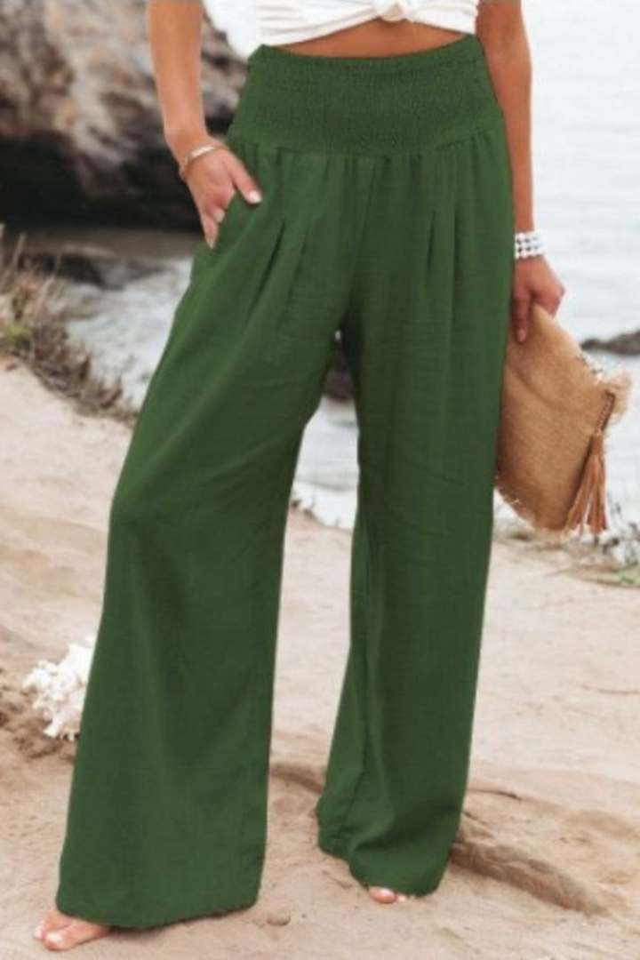 Women's wide leg linen trousers styled for casual summer fashion, paired perfectly.