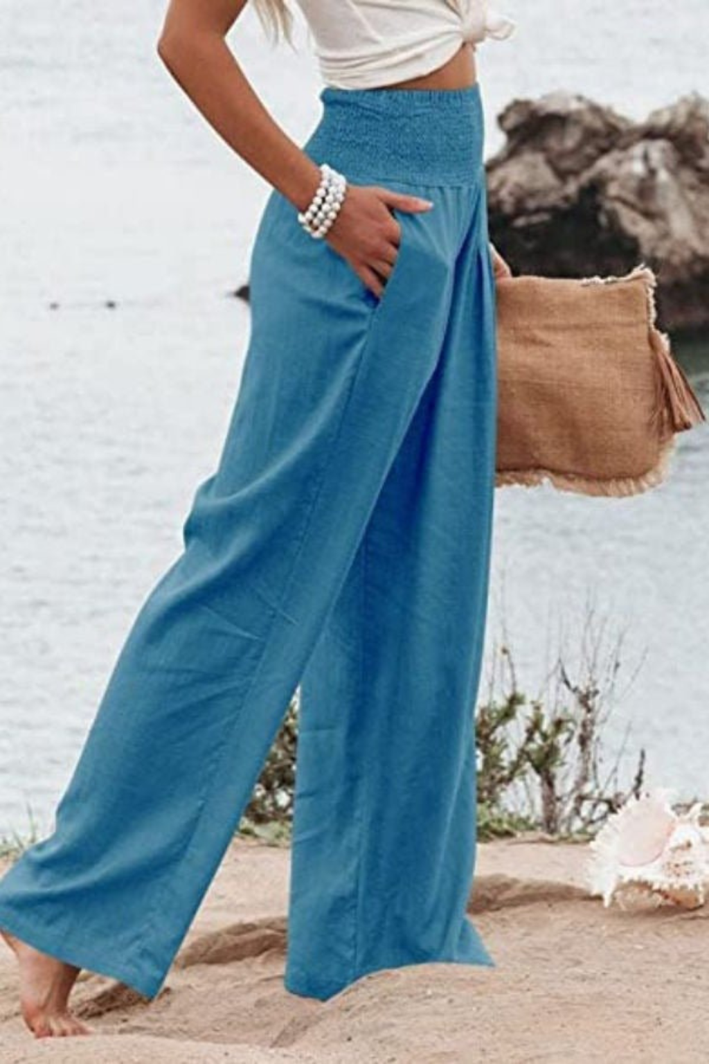 Side view of women's comfortable wide leg linen pants, highlighting their flowy silhouette.