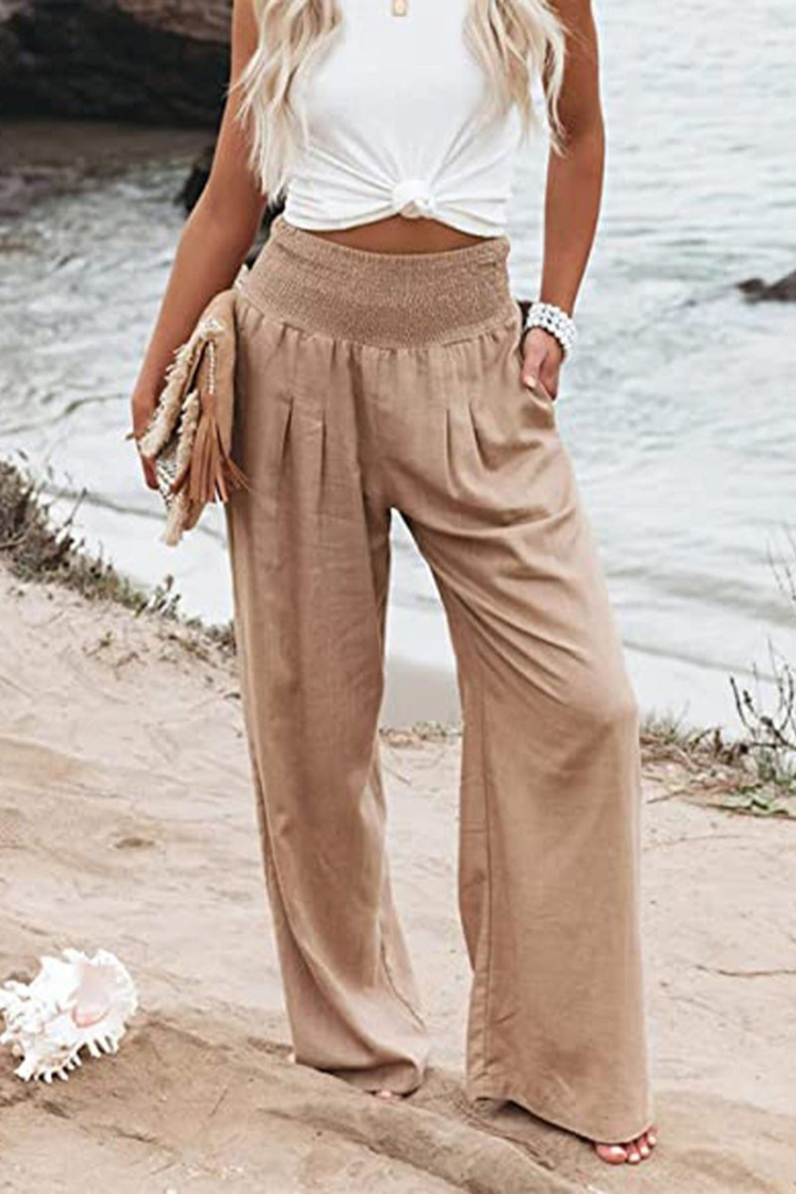 Versatile women's flowy linen wide leg trousers, great for chic or casual summer outfits.