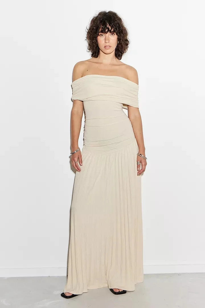 Navy elegant off-shoulder flowy maxi dress, ideal for summer evenings.
